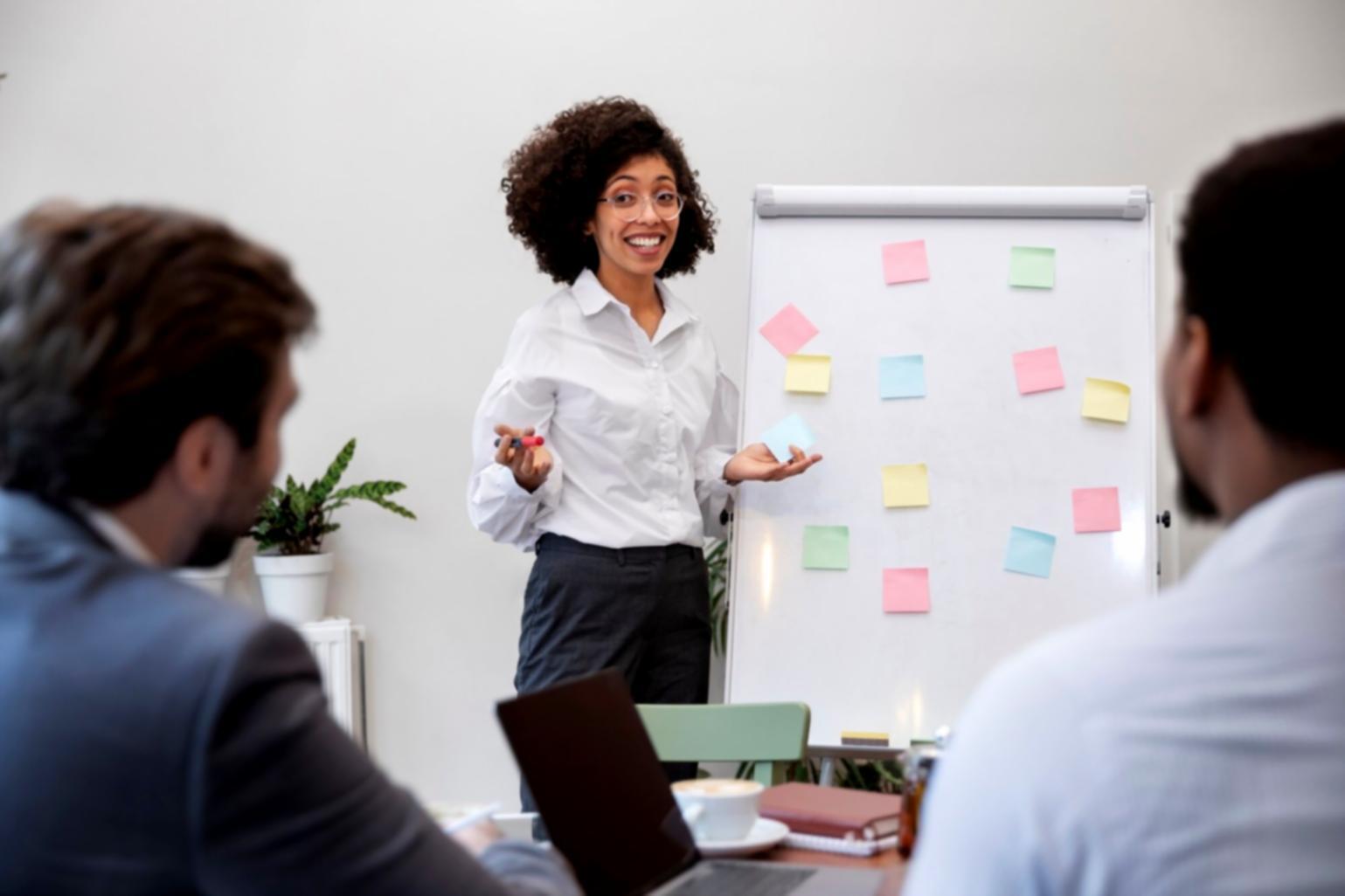 Financial consultant reviewing business processes with client team